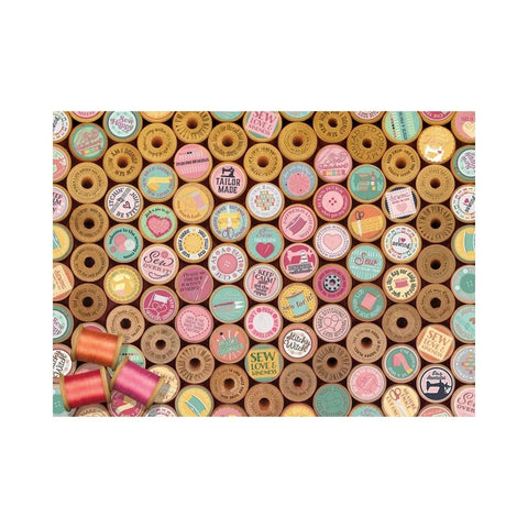 Pattern of colorful spools of thread with various designs on a white background